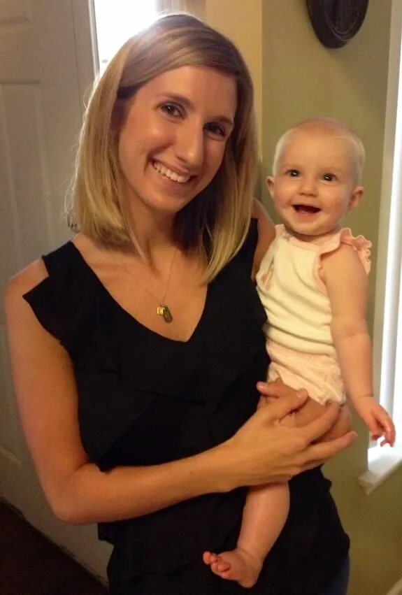 Emily holding baby Ellie at home