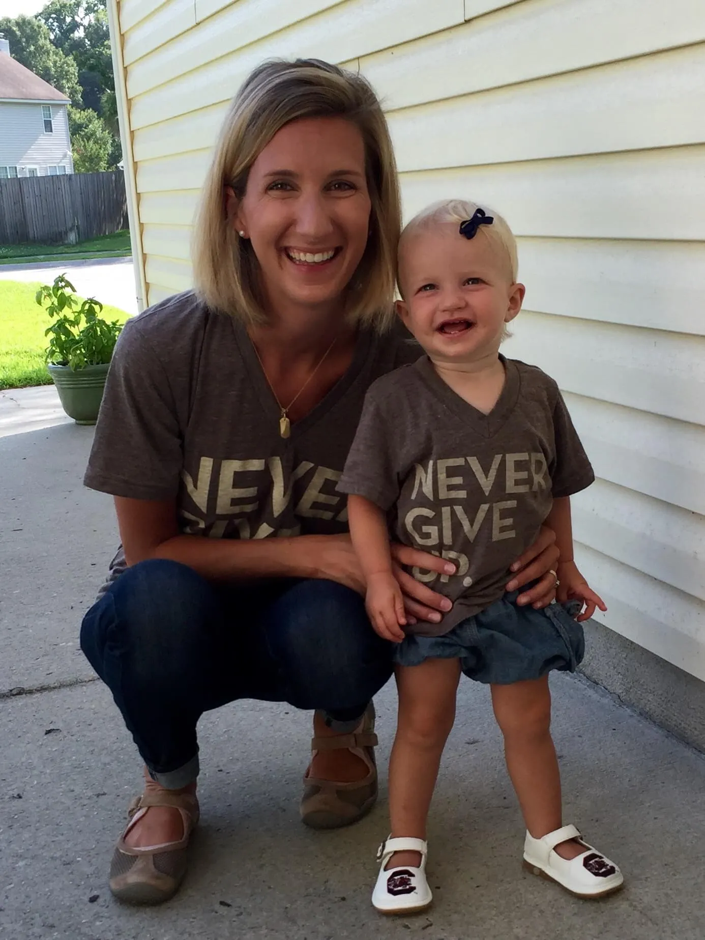 Emily and her daughter Ellie in matching Never Give Up shirts